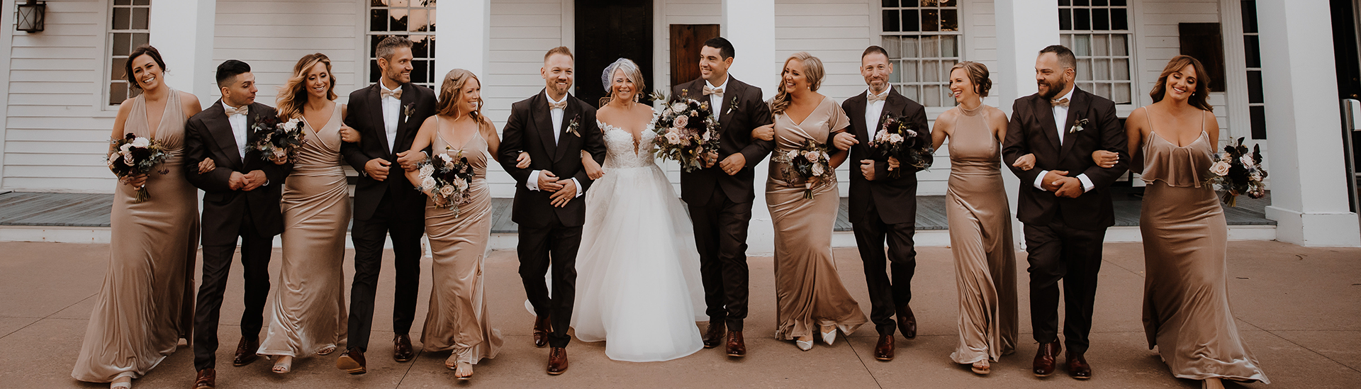 Erin-Rachael-Photography_ET_1920x1440 Wedding party poses in front of Eagle Tavern for a photo. Photo by Erin Rachael Photography.